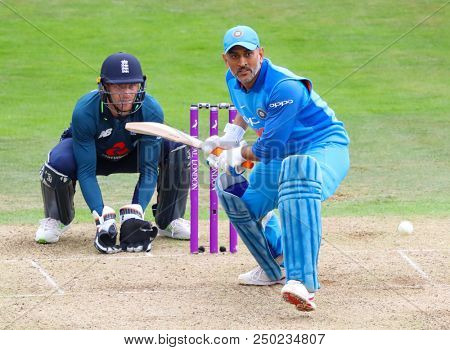 LEEDS, ENGLAND - JULY 17: Jos Buttler and MS Dhoni during the 3rd Royal London One day International match between England and India at Headingley Cricket Ground on July 17, 2018 in  England.  