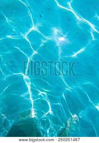 Turquoise Salt Water Of A Beach Of Mallorca In Spain, The Mediterranean Sea.
