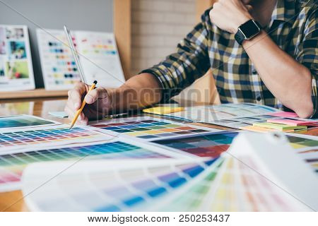 Young Creative Graphic Designer Using Graphics Tablet To Choosing Color Swatch Samples Chart For Sel