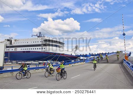 Denmark, Hirtshals- June 05, 2013 Cyclists Disembarkation From The Ferry