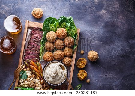Close View Of Falafel, Babaghanoush And Pastrami In The Wooden Box, Copyspace