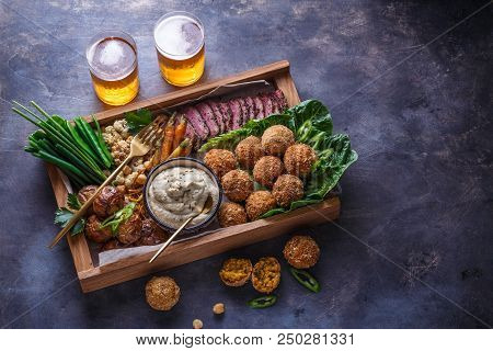 Middle Eastern Party Food: Falafel, Babaghanoush, Potatoes Beef Green Veggies