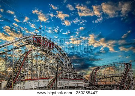The Cyclone Roller Coaster In Coney Island Ny, Brooklyn. Added New Back Ground Of Clouds And Gave Th