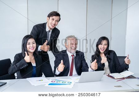 group of successful businessman. Discussion of the business profits of the company in meeting roon o