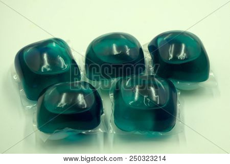 Two Washing Gel Capsule Pods With Laundry Detergent Isolated On White Background With Clipping Path