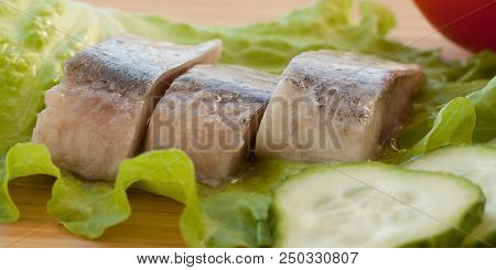 Appetizer Of Herring, Cucumbers, Tomatoes And Lettuce