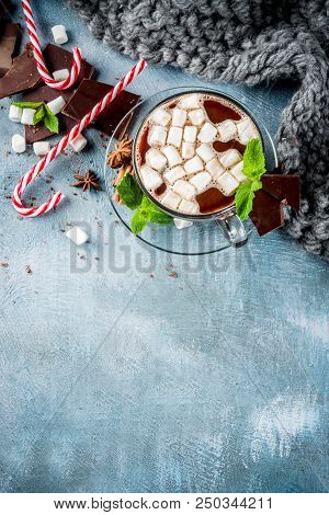 Homemade Hot Chocolate With Mint, Candy Cane And Marshmallow, Light Blue Background With Warm Blanke