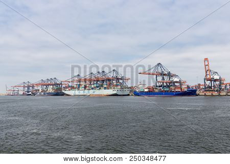 Rotterdam, The Netherlands - June 5 2018: Container Terminal In Dutch Harbor Rotterdam With Cargo Sh