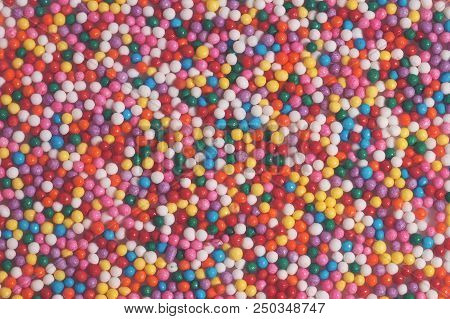 Colorful Bright Background Of Small Balls For Screen Saver For Designer. Multicolored Painted Grains