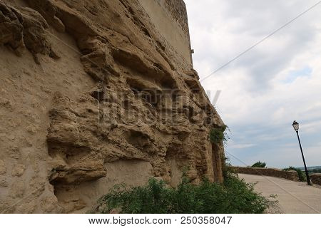 Photography Showing An Old Wall Turning Into Stand. The Photography Was Taken From The Small Village
