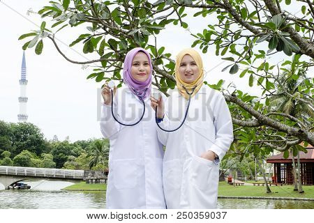 Muslimah Medical Practitioner Posed With Their Stethoscope At Park During Lunch Hour