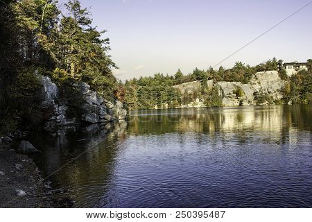 Ripples On A Lake In Upstate New York With Mountains And Trees.