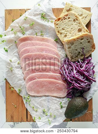 Butchers Made Free Range Raw Lean Unsmoked Bacon Pork Medallions And Hen Eggs On Wooden Box.