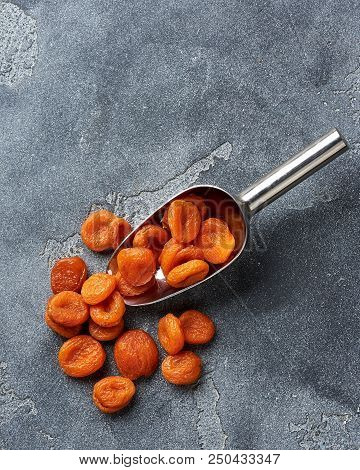 Dried Apricots On Gray Background. Witn Copy Space. Top View.