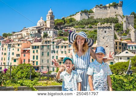 Family Travel In Ilaly. Happy Family From Mother And Two Child In Porto Venere Sityscape. La Spezia,