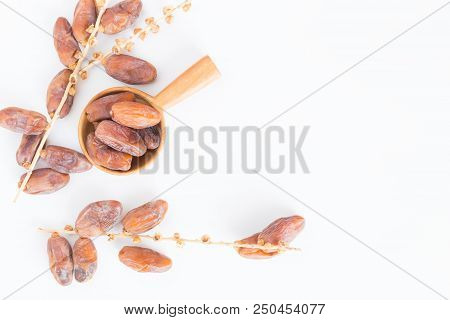 Dates Fruit In Wooden Ladle On White Background,dried Date Palm Fruits Top View