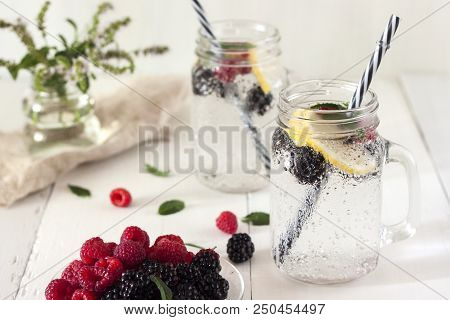 A Cooling Lemon Drink In A Glass Cup On A Wooden Table