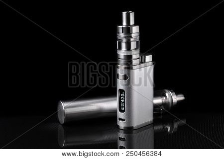 Metallic Electronic Cigarette Or Vaping Device On Black Background