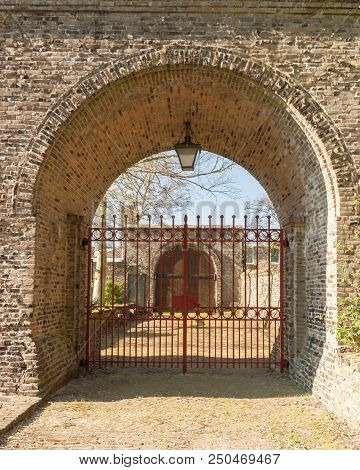 Egmond-binnen, Netherlands - 04-10-2016: Brick Entry Gate To The Cloister Garden Of The Saint Liobac