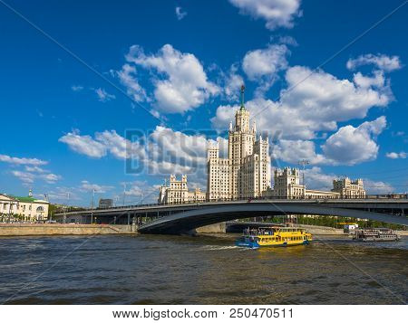 Moscow, Russia - May 12. 2018. Moskva - Ships Sail On River Past Skyscraper On A Kotelnicheskaya Emb