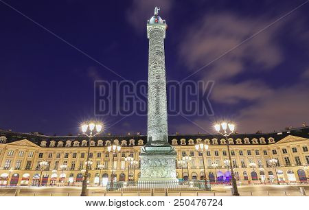 Vendome Column With Statue Of Napoleon Bonaparte, On The Place Vendome At Night, In France. Vendome 
