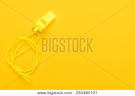 Plastic Referee Whistle. Referee Whistle On The Yellow. Plastic Referee Whistle With Copy Space. Min