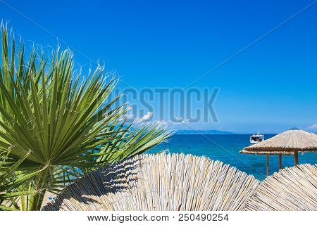 Sun Umbrella And A View Of The Sea