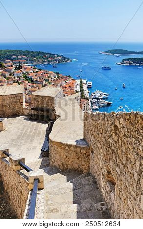 Hvar City And The Harbor From The Spanish Fortress In Coratia  (vertical Oriented Image)