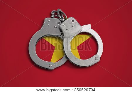 Vietnam Flag  And Police Handcuffs. The Concept Of Observance Of The Law In The Country And Protecti