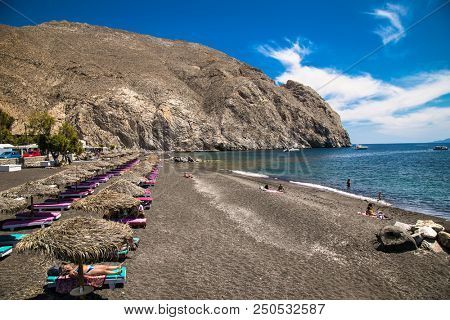 Permissa black sand beach in Santorini. Greece. 