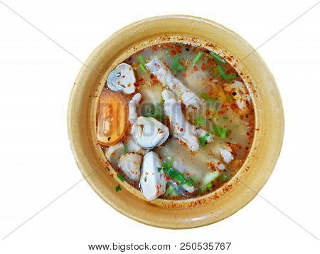 Thai Food Style,top View Of Chicken Feet Spicy Soup With Tomato, Mushroom, Chilli And Coriander In Y
