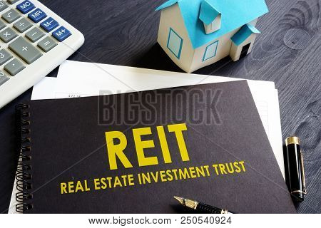 Real Estate Investment Trust Reit On An Office Desk.