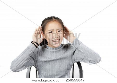Asian Teenager Raise Hand Up To Hearing Isolated White Background