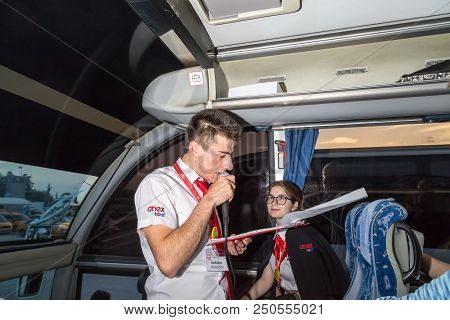 Marmaris, Turkey - May 19, 2018: Male Tour Guide With A Microphone In The Bus In Evening Time