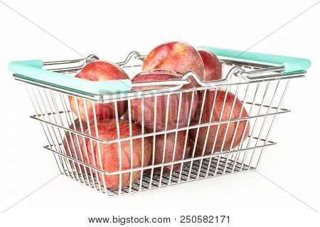 Lot Of Whole Fresh Pluot Interspecific Plums Variety In A Shop Basket Isolated On White