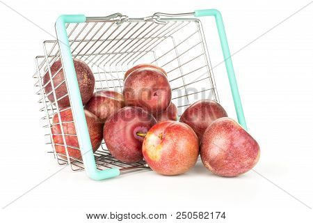 Lot Of Whole Fresh Pluot Interspecific Plums Variety Out Of A Shop Basket Isolated On White