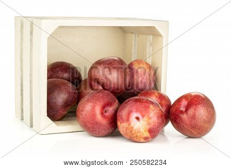 Lot Of Whole Fresh Pluot Interspecific Plums Variety Out Of A Natural Wooden Crate Isolated On White