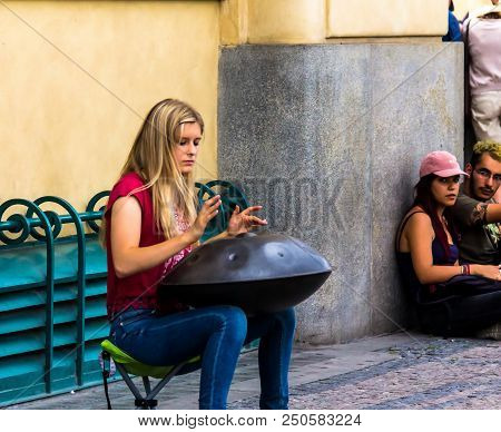 Prague, Czech Republic -july 23,2017: Young Woman Playing On A First Generationan Instrument Called 