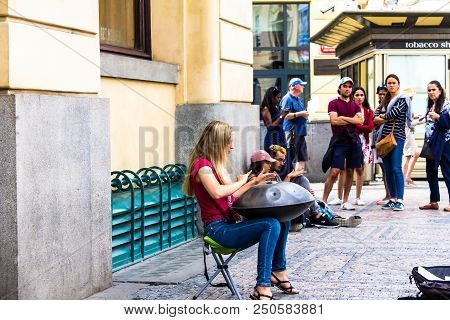 Prague, Czech Republic -july 23,2017: Young Woman Playing On A First Generationan Instrument Called 