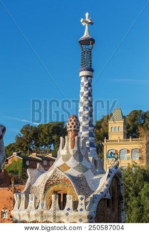 Barcelona, Spain - March 28, 2018: Famous Casa del Guarda in Park Guell in Barcelona, Spain. Top view