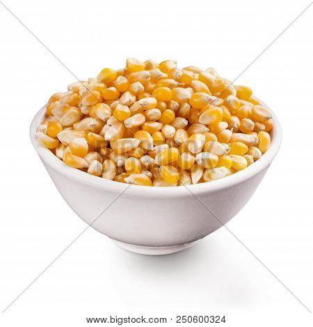 Unpopped Popcorn Seeds In Ceramic Bowl, Isolated On White Background.