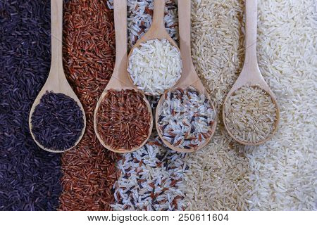 Food Background With Top View Of Five Rows Of Rice In A Wooden Spoon.