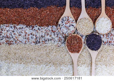 Food Background With Top View Of Five Rows Of Rice In A Wooden Spoon.