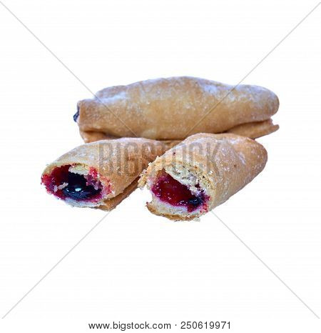 Cookies Rolled With Cherries And Black Currants Isolated On A White Background. Sweet Dessert.