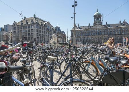 Amsterdam, Netherlands - July 02, 2018: Bicycle Parking In The Central Dam Square In Amsterdam