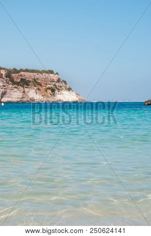 Crystalline Light Blue Sea With Promontory Of One Of The Most Famous Little Cove Of Island