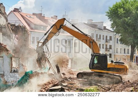 excavator crasher machine at demolition on construction site