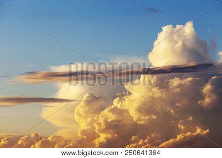 Heapy Clouds With Warm Sunset's Ray.