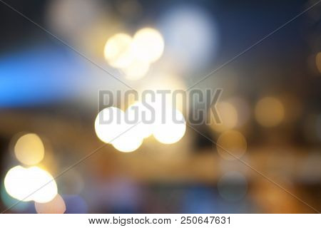 Many Blurred Small Electric Bulbs. A Blurry Photo Of The City