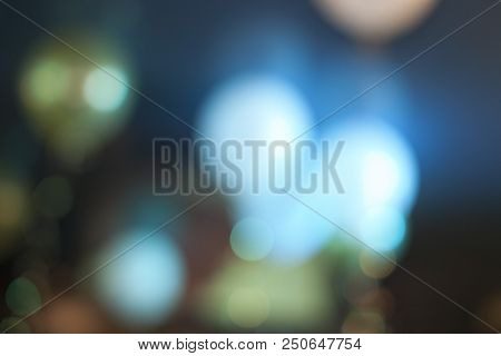 Many Blurred Small Electric Bulbs. A Blurry Photo Of The City